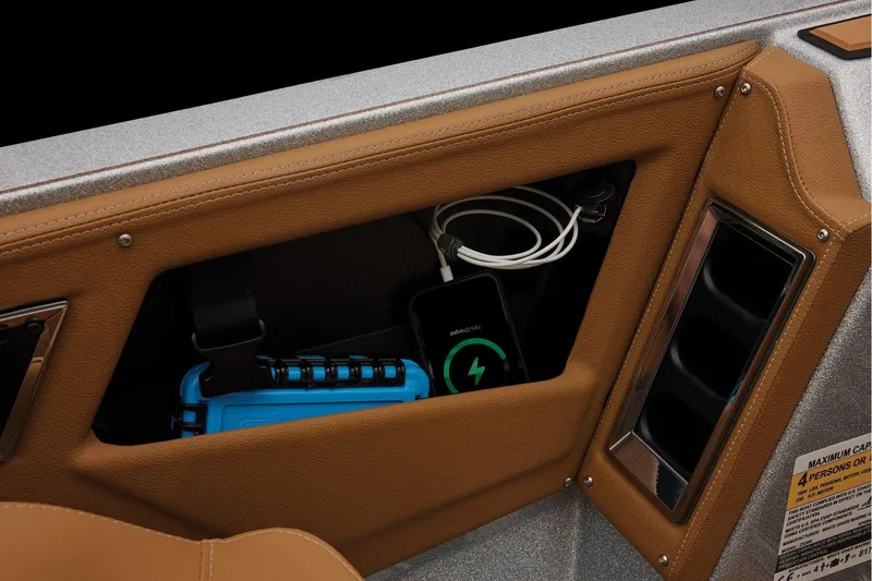 Slide: The Image of Manufacturer Provided Image: Interior storage compartment of 2026 Ranger Z520R Ultra with charging device and accessories. - 44