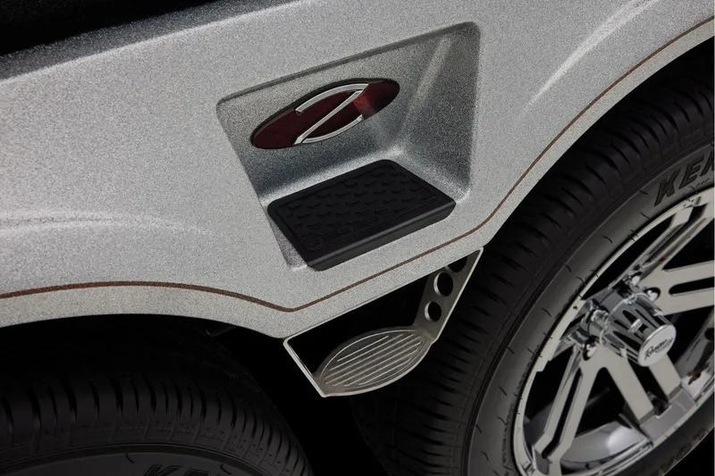 Slide: The Image of Manufacturer Provided Image: 2026 Ranger Z520R Ultra trailer step detail with chrome wheel and textured surface. - 72