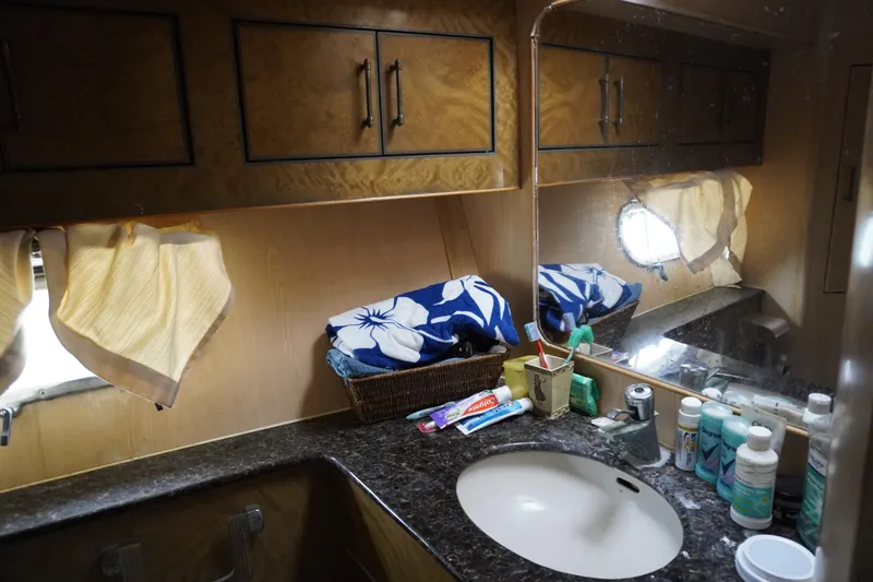 Slide: The Image of Bathroom interior of 1992 Horizon Power Boat with toiletries and mirror. - 13