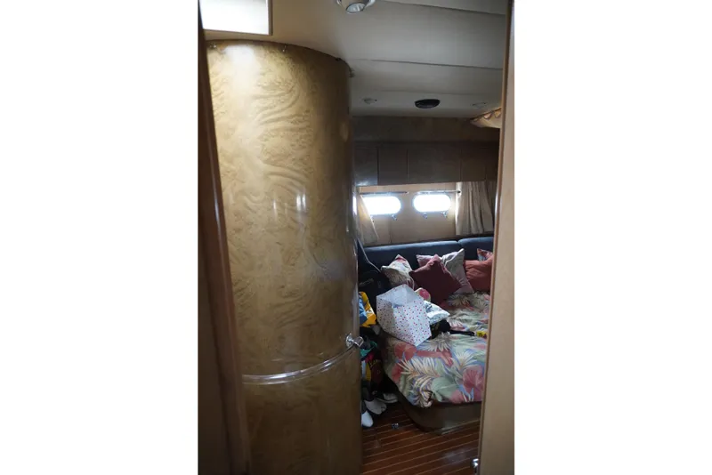 Slide: The Image of Interior cabin of 1992 Horizon power boat with bed and porthole windows. - 15