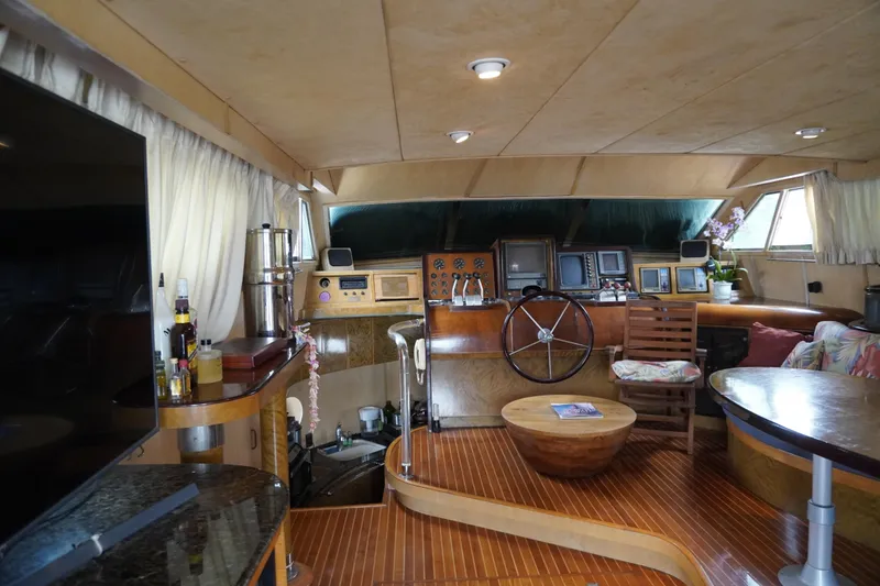 Slide: The Image of Luxurious 1992 Horizon power boat interior with wooden accents and modern navigation equipment. - 17