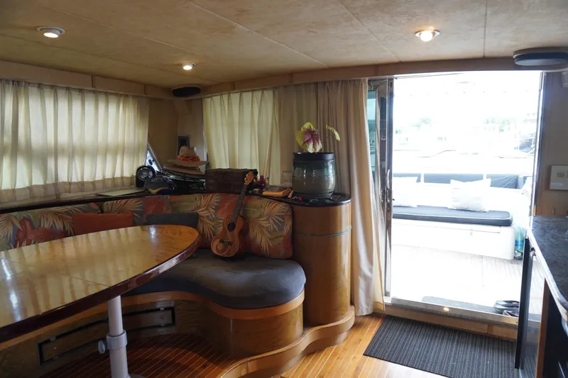 Slide: The Image of Interior of 1992 Horizon Power Boat with cozy seating and open deck view. - 26