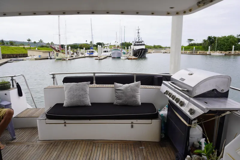 Slide: The Image of Outdoor seating and grill on 1992 Horizon Power Boat, docked in a marina. - 27