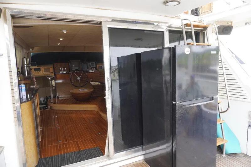 Slide: The Image of Interior of a 1992 Horizon power boat with wooden flooring and modern amenities. - 28