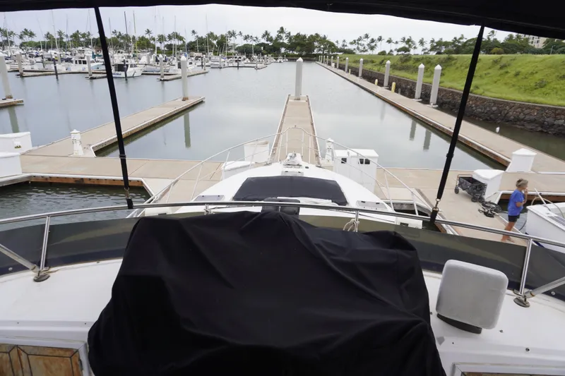 Slide: The Image of 1992 Horizon power boat docked at marina with scenic view. - 29