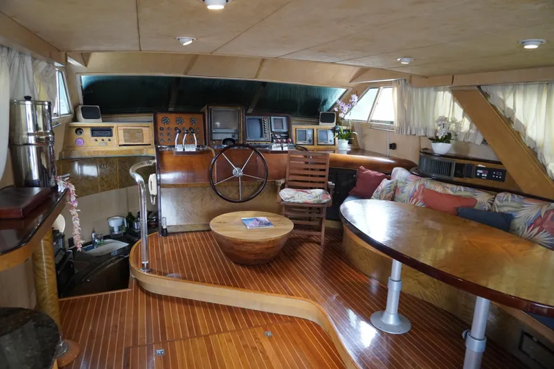 Slide: The Image of Luxurious 1992 Horizon power boat interior with wooden flooring and plush seating. - 3