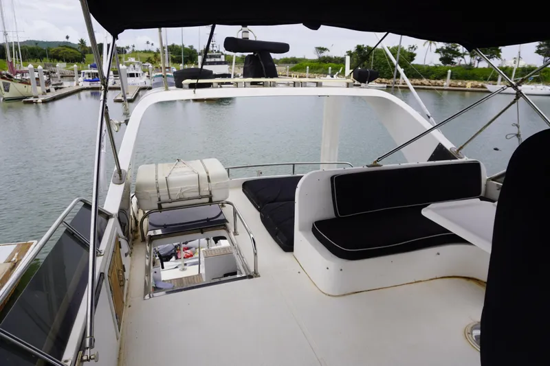 Slide: The Image of 1992 Horizon Power Boat interior with seating, docked at marina. - 30