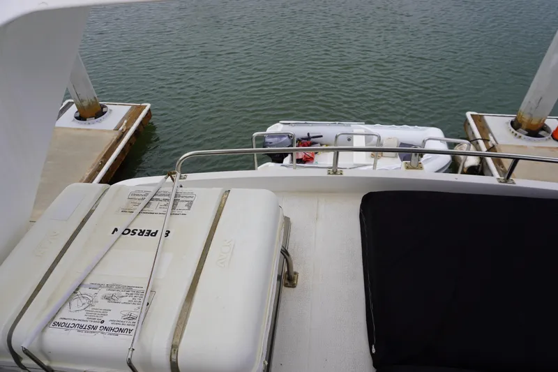 Slide: The Image of 1992 Horizon Power Boat docked with safety equipment visible. - 31