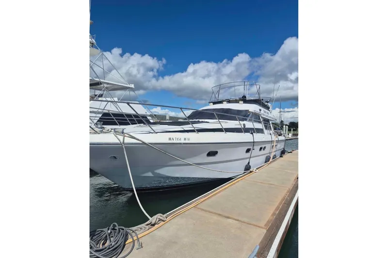 Slide: The Image of 1992 Horizon power boat docked under a clear blue sky. - 34