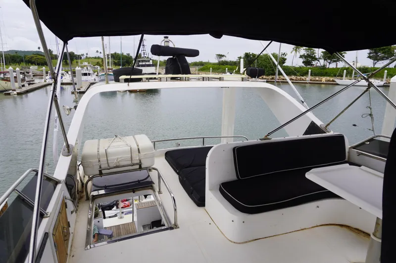 Slide: The Image of 1992 Horizon power boat interior with seating, docked in a marina. - 6