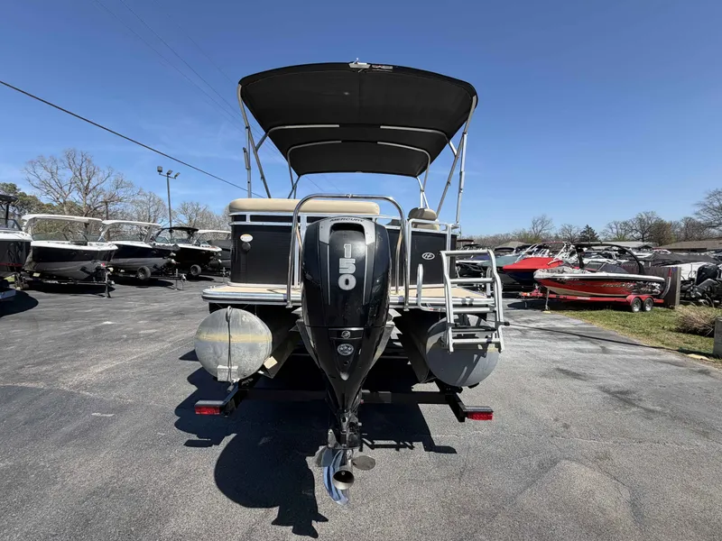 Slide: The Image of 2013 Harris Cruiser 240 pontoon boat in parking lot. - 3
