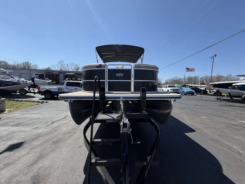 Slide: The Image of 2013 Harris Cruiser 240 pontoon boat in a parking lot. - 6