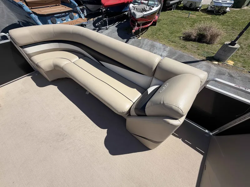Slide: The Image of 2013 Harris Cruiser 240 pontoon boat with beige seating area. - 7