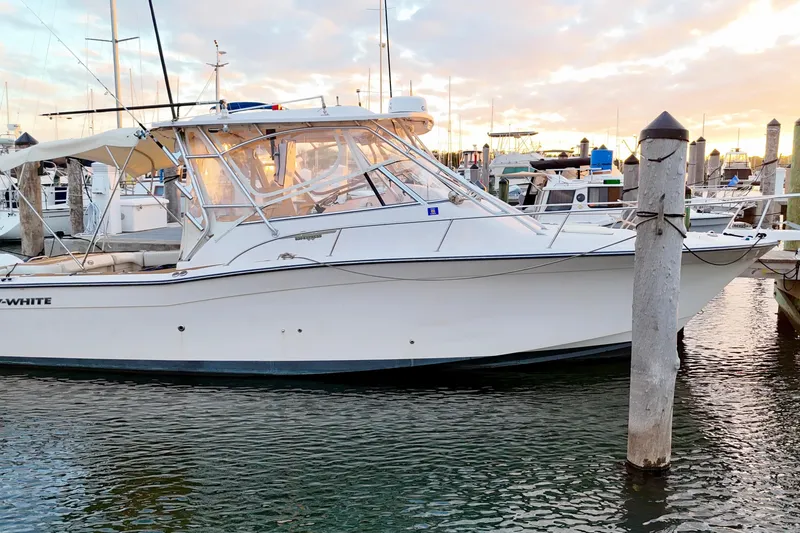 Slide: The Image of 2006 Grady-White Express 330 boat docked at marina during sunset. - 14