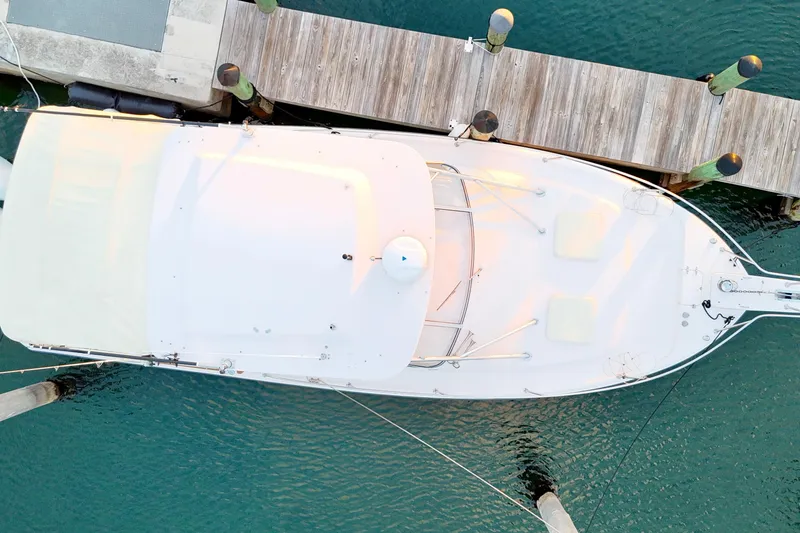 Slide: The Image of Overhead view of 2006 Grady-White Express 330 docked at a wooden pier. - 23