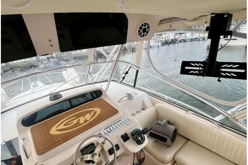 Slide: The Image of 2006 Grady-White Express 330 boat interior with steering wheel and control panel. - 27