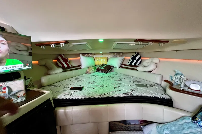 Slide: The Image of Interior of 2006 Grady-White Express 330 boat with cozy bed and TV. - 30