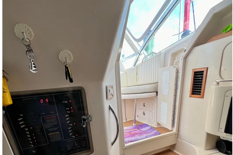 Slide: The Image of Interior view of a 2006 Grady-White Express 330 boat cabin with control panel. - 31