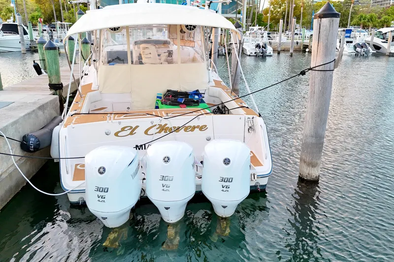 Slide: The Image of 2006 Grady-White Express 330 boat docked with triple Yamaha 300 V6 engines. - 6