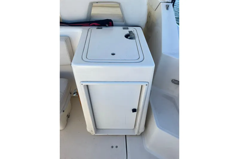Slide: The Image of 1996 Tiara Yachts 3500 Express boat interior with compact storage compartment. - 12