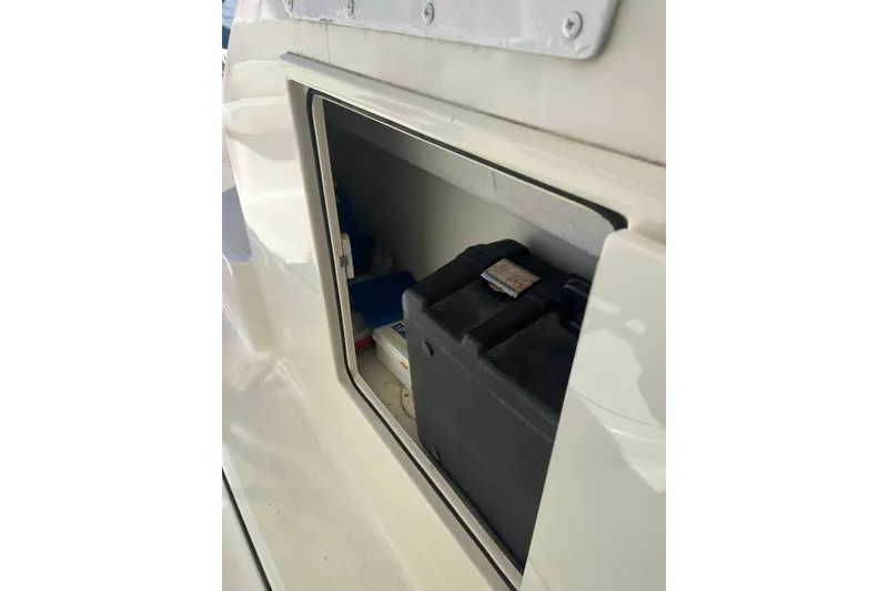 Slide: The Image of Storage compartment on a 1996 Tiara Yachts 3500 Express boat. - 23