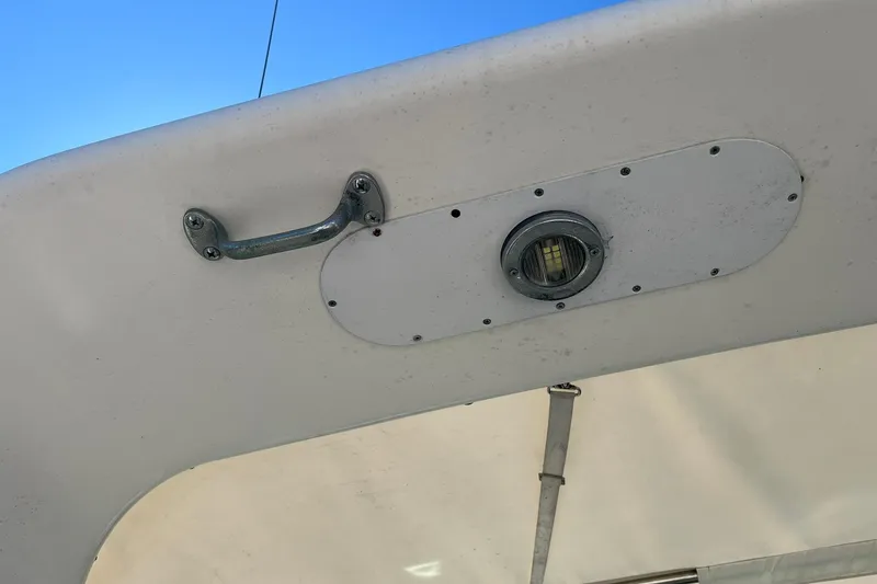 Slide: The Image of 1996 Tiara Yachts 3500 Express boat detail with handle and light fixture. - 30