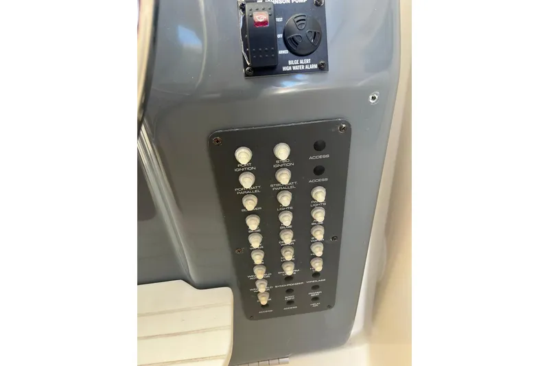 Slide: The Image of Control panel of a 1996 Tiara Yachts 3500 Express, featuring ignition and bilge alarm switches. - 40