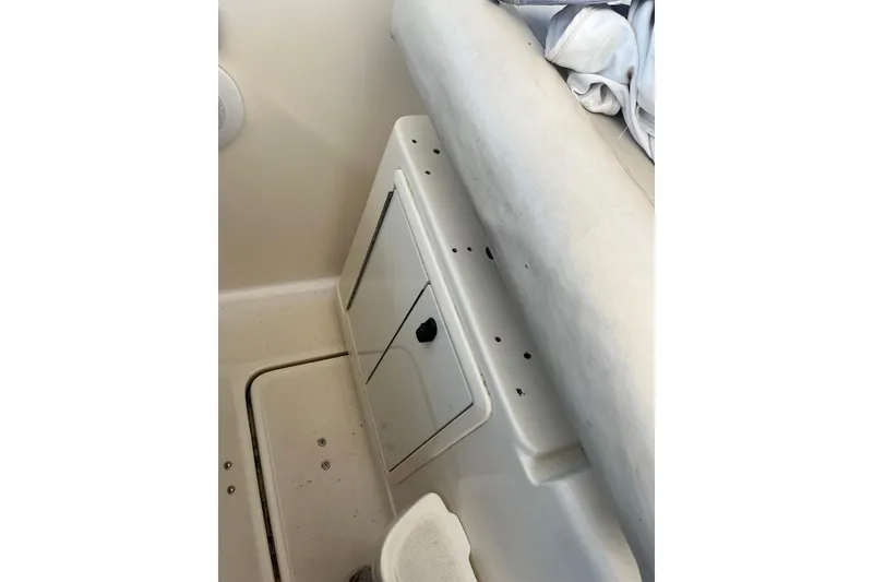 Slide: The Image of 1996 Tiara Yachts 3500 Express interior storage compartment with cushioned seating. - 41
