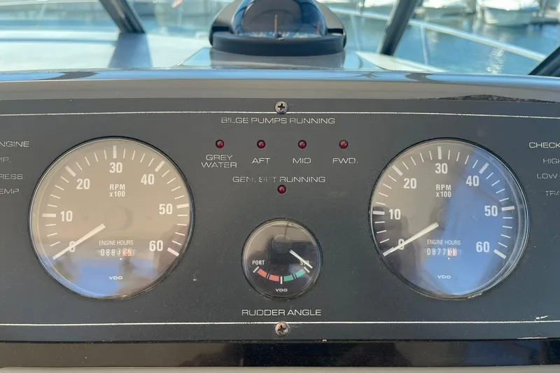 Slide: The Image of Dashboard of a 1996 Tiara Yachts 3500 Express showing RPM gauges and indicators. - 45