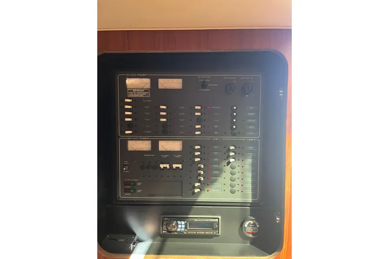 Slide: The Image of Control panel of a 1996 Tiara Yachts 3500 Express boat. - 47