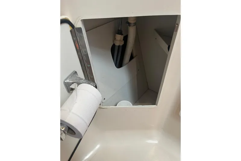 Slide: The Image of Access panel in 1996 Tiara Yachts 3500 Express, showing interior plumbing and wiring. - 58