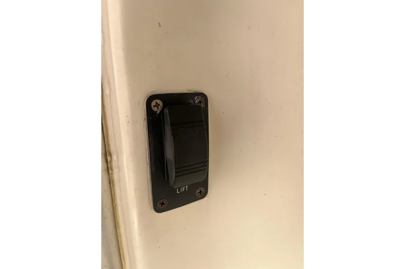 Slide: The Image of Switch labeled "Lift" on 1996 Tiara Yachts 3500 Express boat interior. - 6