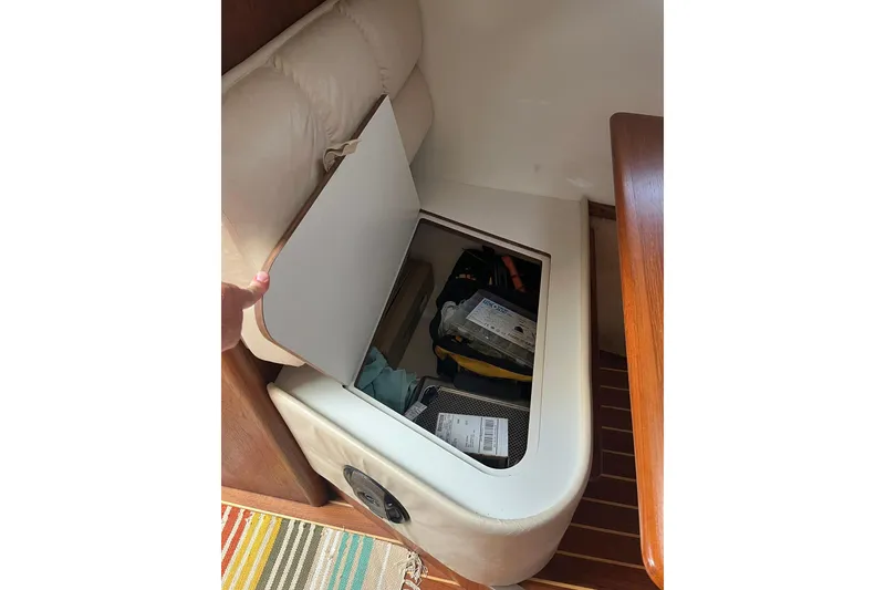 Slide: The Image of Storage compartment in 1996 Tiara Yachts 3500 Express, showcasing interior organization. - 62
