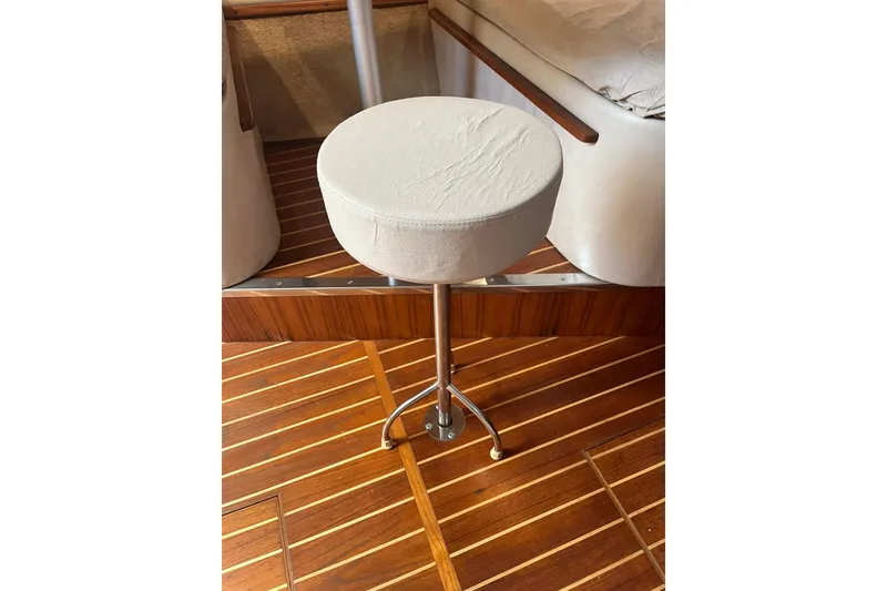 Slide: The Image of White stool on wooden deck of 1996 Tiara Yachts 3500 Express. - 68