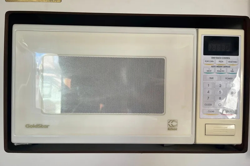 Slide: The Image of GoldStar microwave with one-touch controls, installed in a 1996 Tiara Yachts 3500 Express. - 84