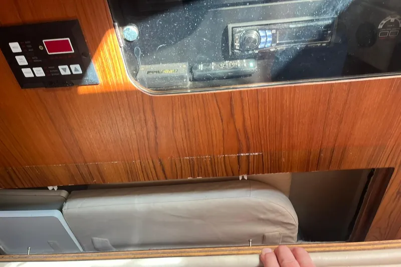 Slide: The Image of 1996 Tiara Yachts 3500 Express interior with control panel and stereo system. - 87