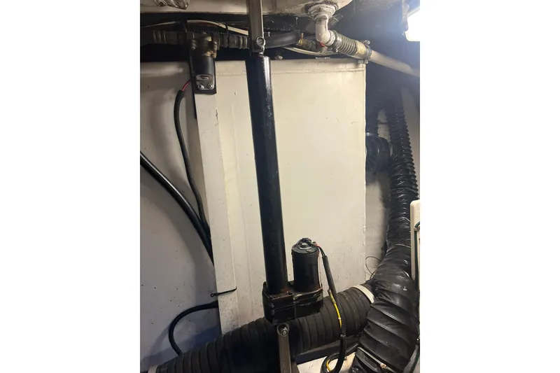 Slide: The Image of Engine room of 1996 Tiara Yachts 3500 Express, showing pipes and wiring. - 95