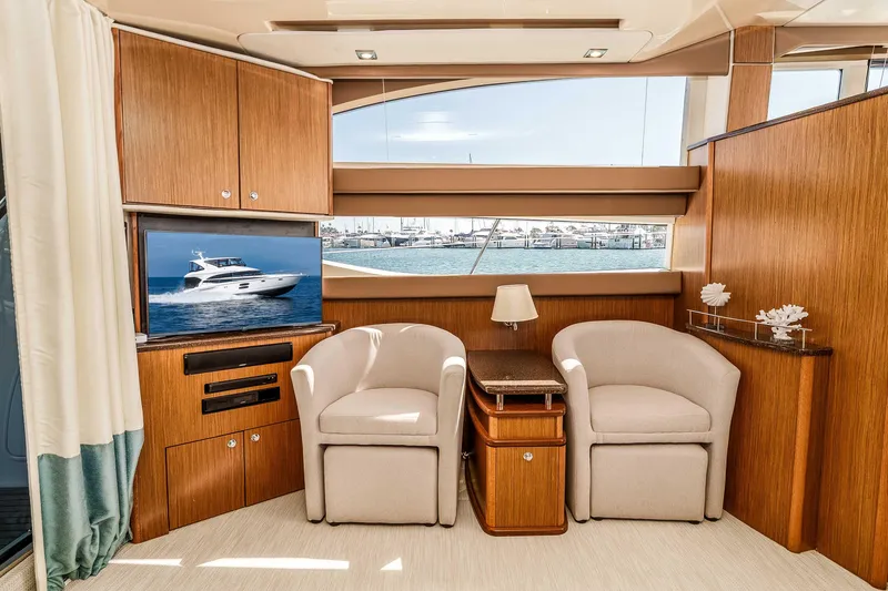 Slide: The Image of Luxurious interior of 2016 Meridian 441 Sedan yacht with elegant seating and scenic window view. - 10