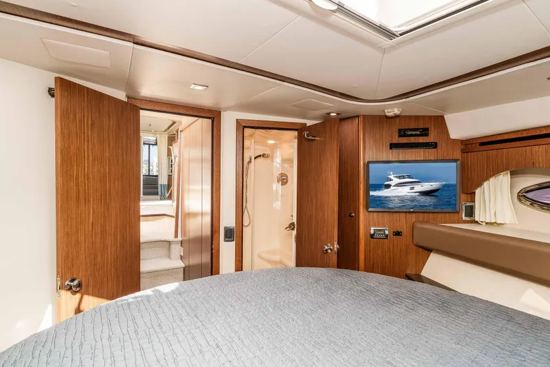 Slide: The Image of Luxurious interior of 2016 Meridian 441 Sedan yacht with wood finishes and modern amenities. - 16