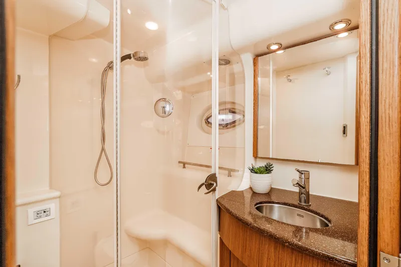 Slide: The Image of Luxurious bathroom in 2016 Meridian 441 Sedan yacht with modern fixtures and elegant design. - 17