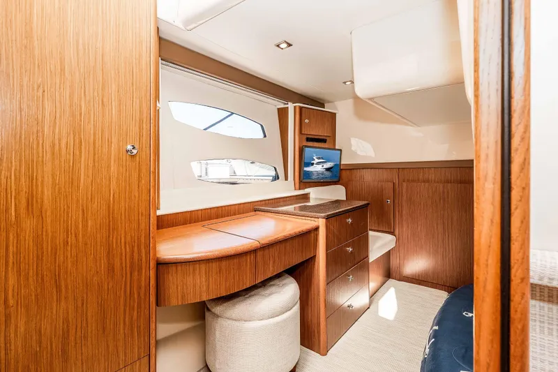 Slide: The Image of Luxurious interior of 2016 Meridian 441 Sedan yacht with wooden cabinetry and seating. - 19