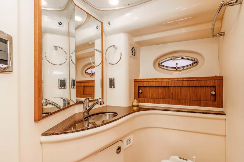 Slide: The Image of Luxurious bathroom interior of 2016 Meridian 441 Sedan yacht with elegant fixtures and wood accents. - 20