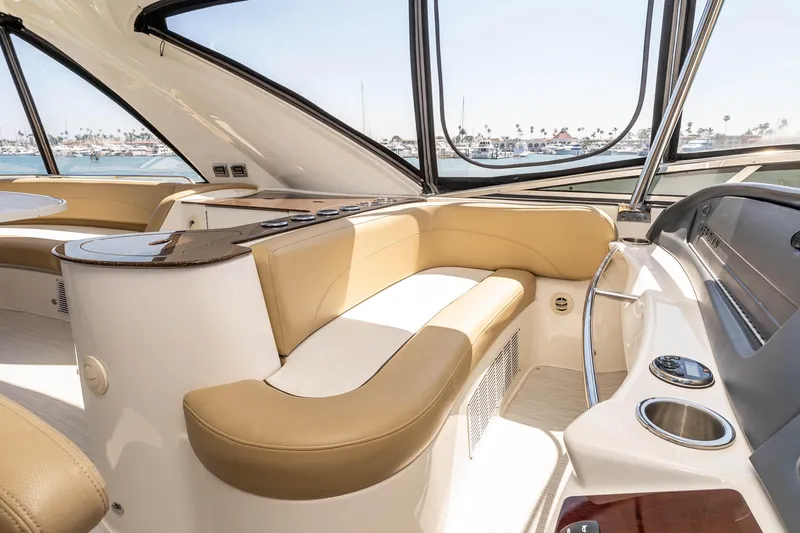 Slide: The Image of Luxurious interior of 2016 Meridian 441 Sedan yacht with beige seating and panoramic windows. - 25