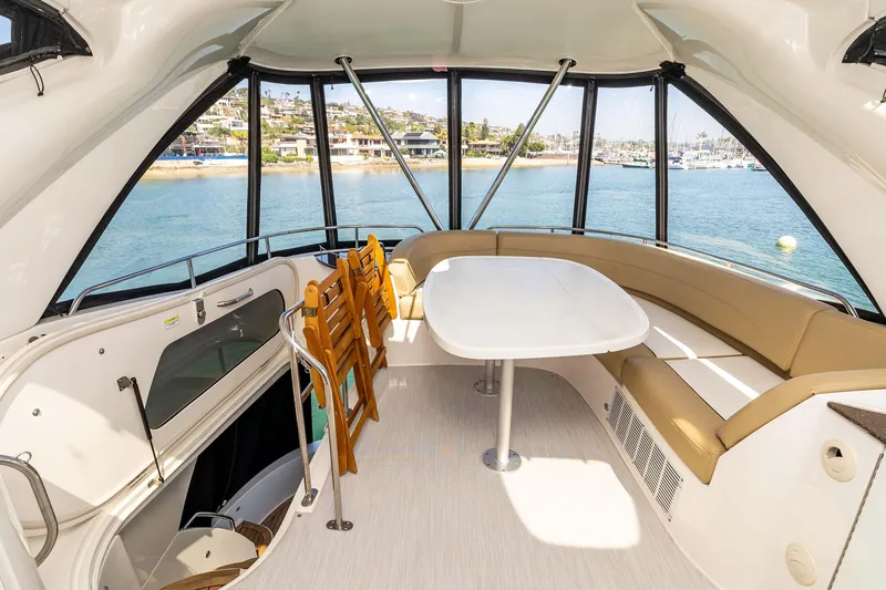 Slide: The Image of Luxurious interior of 2016 Meridian 441 Sedan yacht with panoramic windows and seating area. - 26