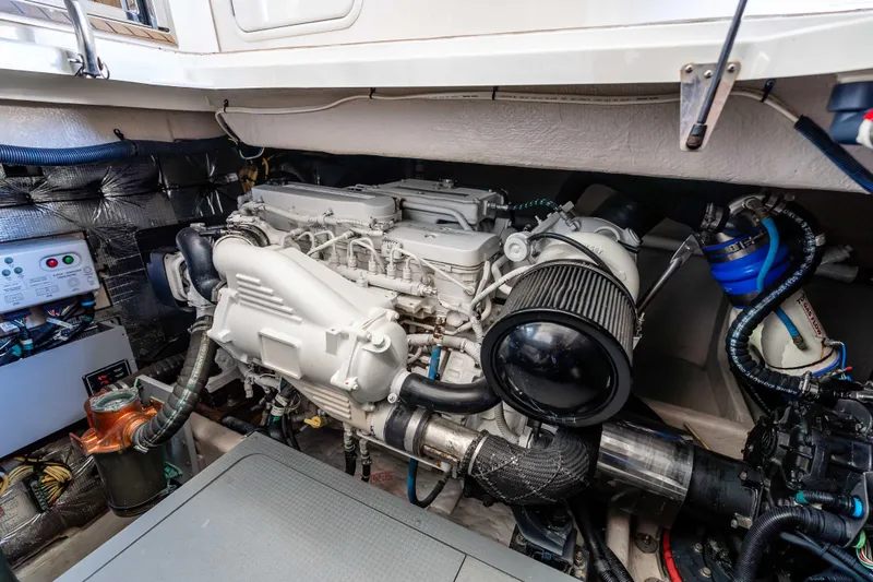 Slide: The Image of Engine room of a 2016 Meridian 441 Sedan yacht, showcasing detailed mechanical components. - 27