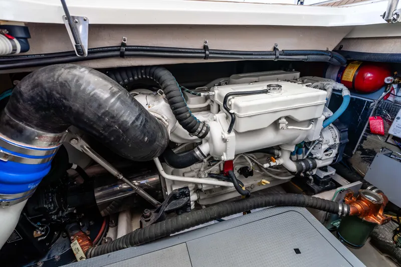 Slide: The Image of Engine compartment of a 2016 Meridian 441 Sedan yacht, showcasing mechanical components. - 28