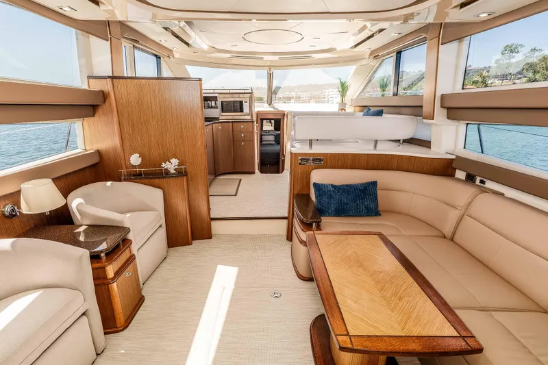 Slide: The Image of Luxurious interior of 2016 Meridian 441 Sedan yacht with elegant furnishings and panoramic windows. - 8