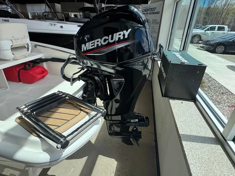 Slide: The Image of Boston Whaler 130 Super Sport 2026 with Mercury outboard motor. - 11