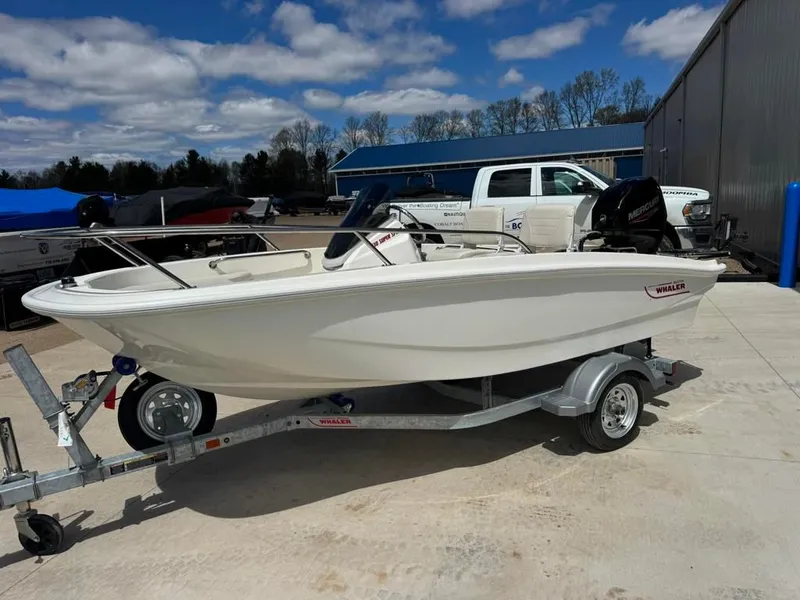 Slide: The Image of 2026 Boston Whaler 130 Super Sport on trailer outdoors. - 4