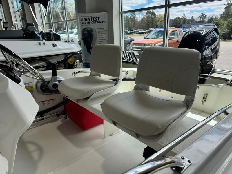 Slide: The Image of Interior of 2026 Boston Whaler 130 Super Sport with comfortable seating. - 9